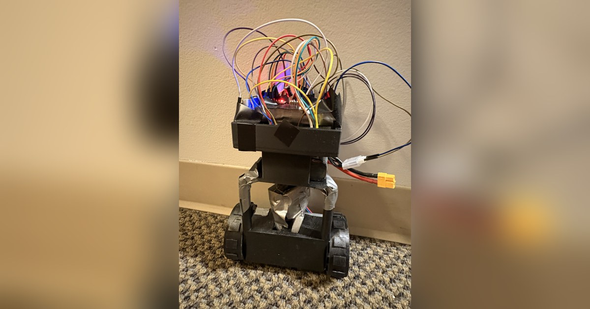 Fotografía de Amadeu Behrend del robot de equilibrio completo, con estructura negra vertical, dos ruedas y Raspberry Pi visible.