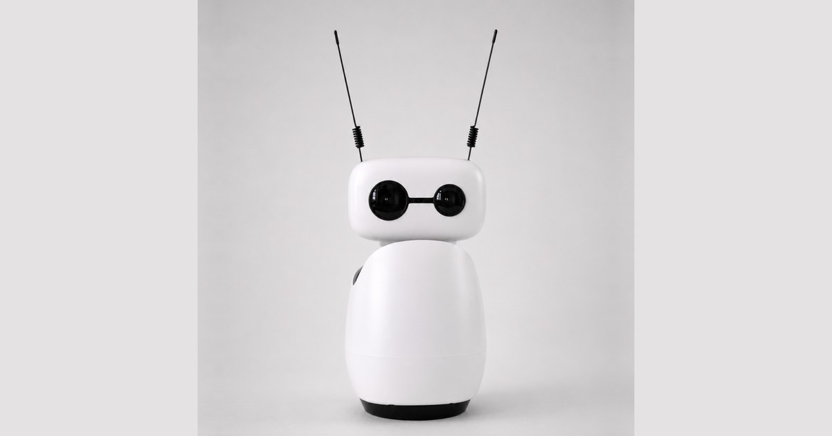 Fotografía oficial de Reachy Mini Wireless blanco visto de frente, con sus dos antenas negras y la base completa sobre un fondo gris claro.