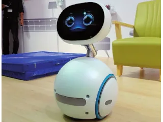 Zenbo de ASUS de cuerpo entero, con pantalla sobre cuello y base redonda con ruedas.