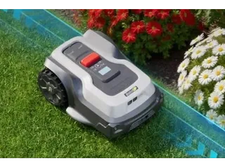 Imagen oficial de RoboUP T1200 Pro completo junto a un borde de césped, recortada de una ilustración del fabricante.
