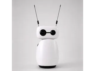 Fotografía oficial de Reachy Mini Wireless blanco visto de frente, con sus dos antenas negras y la base completa sobre un fondo gris claro.