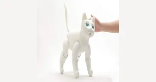 MarsCat blanco de Elephant Robotics interactuando con una mano.