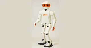 igus Humanoid Open Platform, de cuerpo entero, con carcasa blanca y rostro naranja.