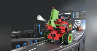 Vehículo de Smart Robots Max con ruedas omnidireccionales y piezas verdes y rojas.