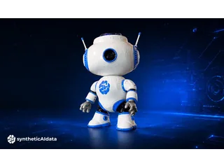 Imagen promocional oficial de JBR-001 completo, con cuerpo blanco y azul, cabeza con cámara y brazos, sobre fondo azul.