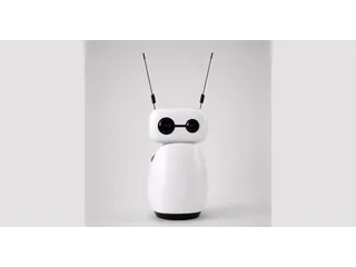 Fotografía oficial de Reachy Mini Wireless blanco visto de frente, con sus dos antenas negras y la base completa sobre un fondo gris claro.