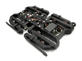 Fotografía oficial de Solo12 con las patas plegadas, publicada por Open Dynamic Robot Initiative.