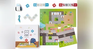 Robot KUBO Coding junto al mapa de actividades y las piezas TagTiles.