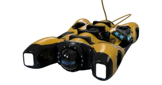 Detalle del render oficial de EXRAY, con su cámara y cable de conexión.