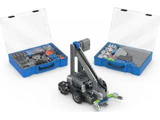 Clawbot de VEX IQ de segunda generación junto a piezas y cajas del Education Kit