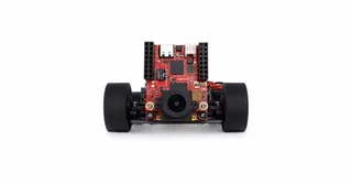 Fotografía de HyperLine Robotics de su vehículo completo visto de frente, con ruedas negras, cámara y electrónica sobre el chasis PCB.