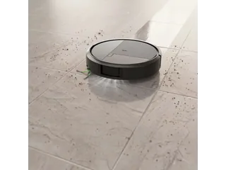 Fotografía promocional oficial de Roomba Plus 575 Combo completo aspirando sobre un suelo claro, publicada por iRobot.