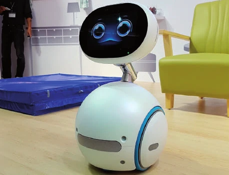 Zenbo de ASUS de cuerpo entero, con pantalla sobre cuello y base redonda con ruedas.