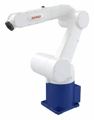 Fotografía del DENSO VM-60B1 completo, extraída del catálogo oficial; conserva base y brida.