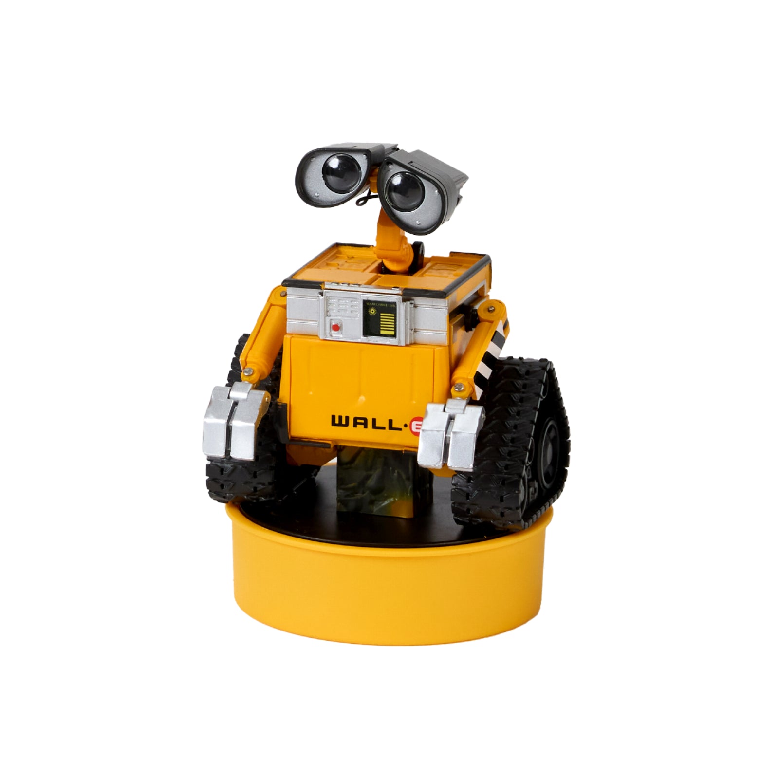 WALL-E Mini de Robosen, amarillo con orugas negras sobre un soporte circular amarillo