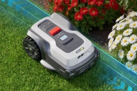 Imagen oficial de RoboUP T1200 Pro completo junto a un borde de césped, recortada de una ilustración del fabricante.